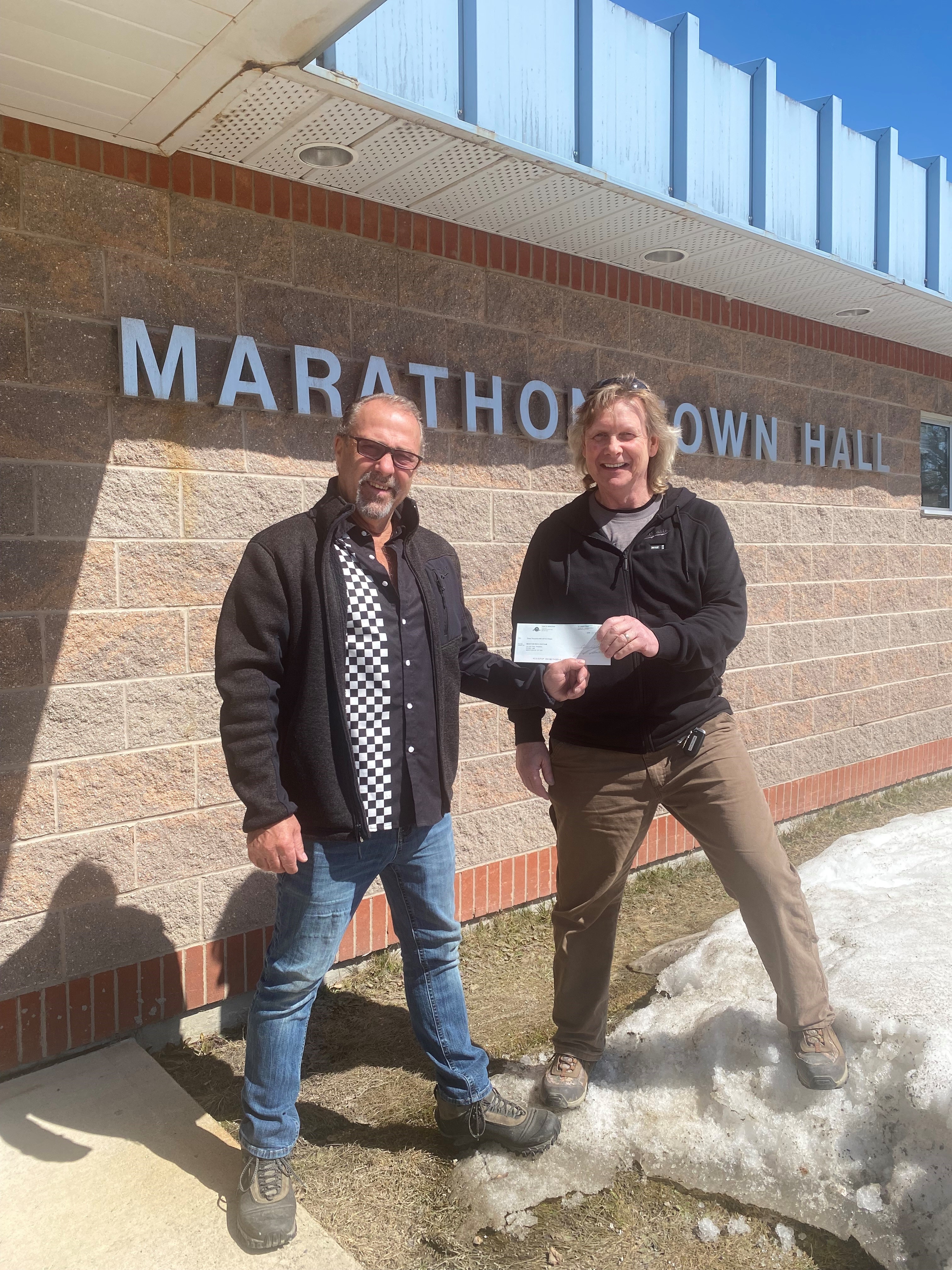 Mayor Dumas handing cheque to club president Colin Reid