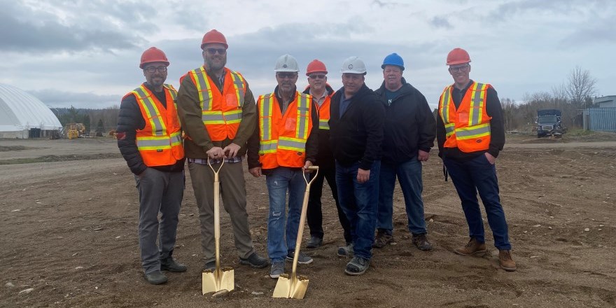 Council holding gold shovels at the Works Yard