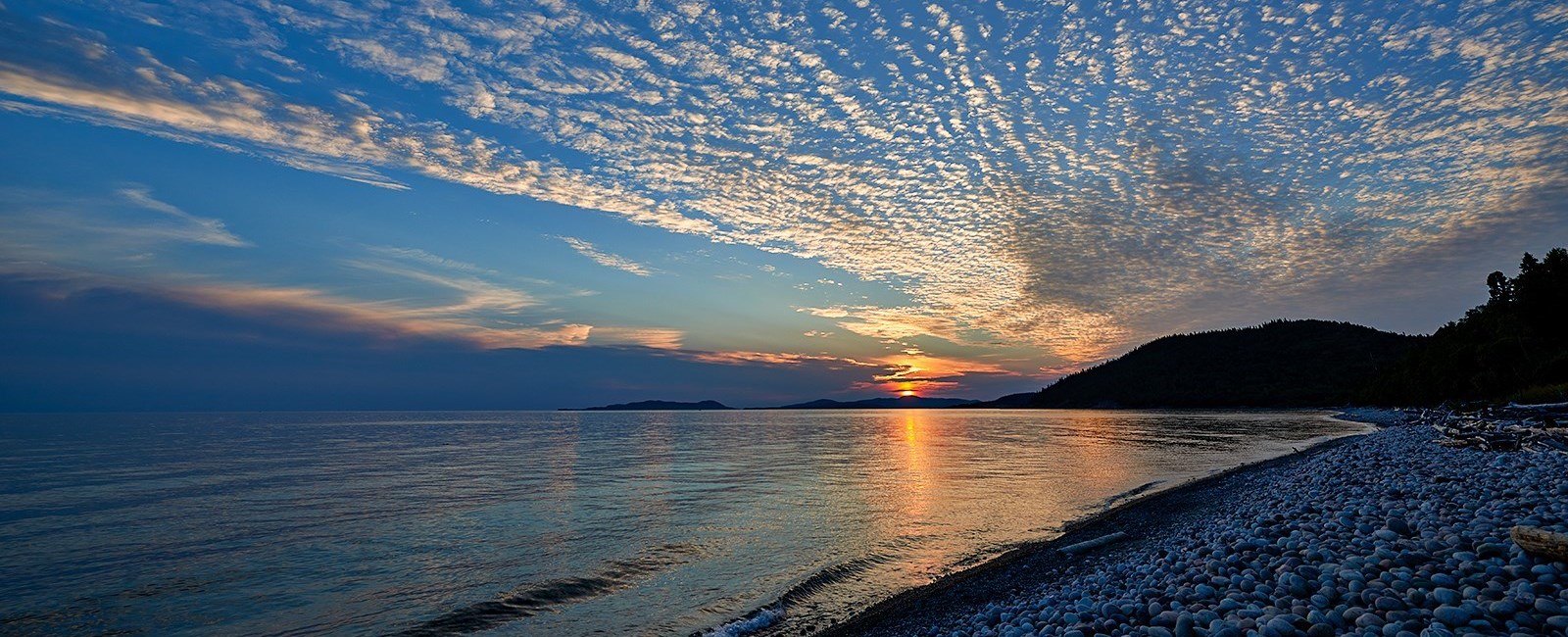 Pebble beach at sunset